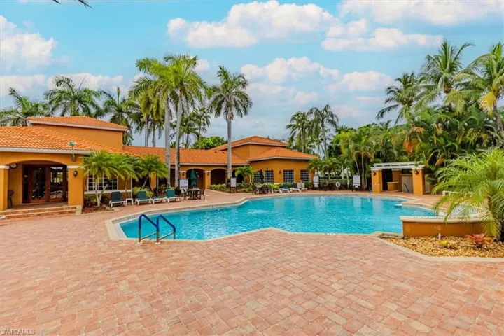Community pool with a patio area