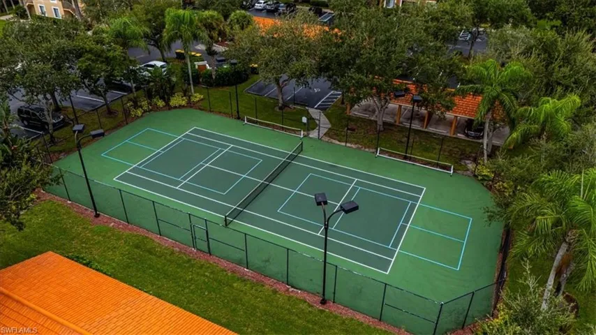View of tennis court featuring community basketball court