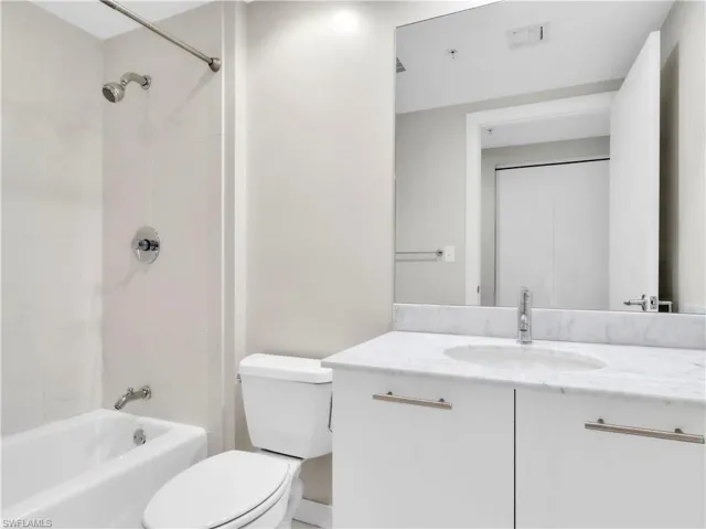 Bathroom with vanity and  shower combination