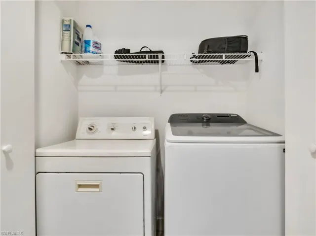 Laundry room with washing machine and clothes dryer
