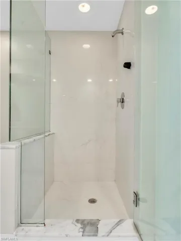 Full bath featuring a shower stall