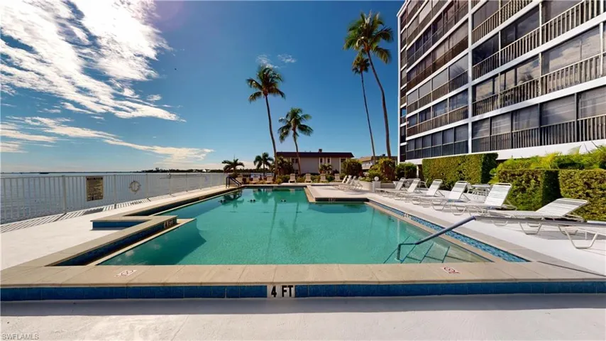 Community pool featuring a patio