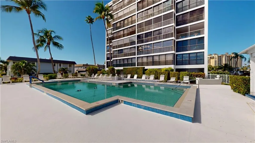 Community pool with a patio area