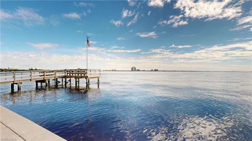 Dock area featuring a water view