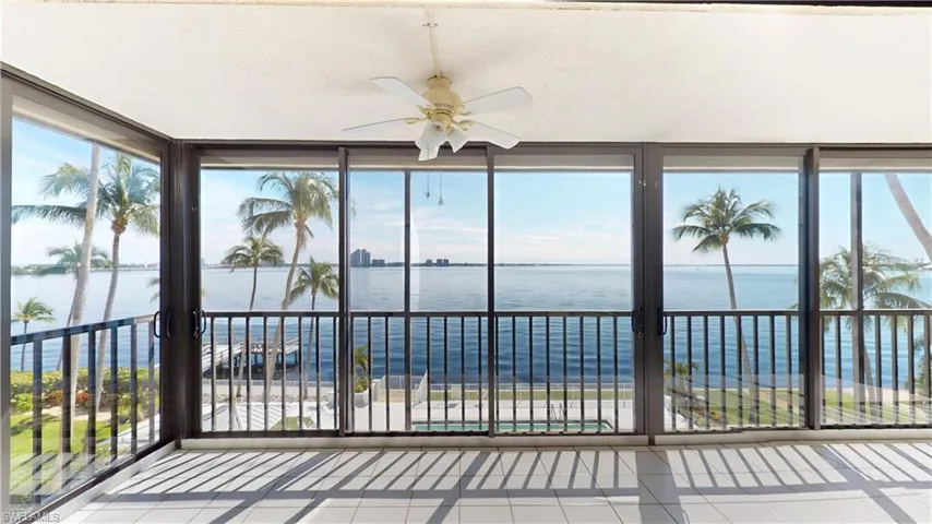 Unfurnished sunroom with a water view