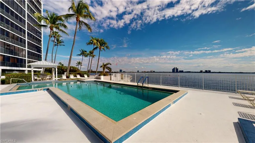 Community pool with a gazebo and a patio area