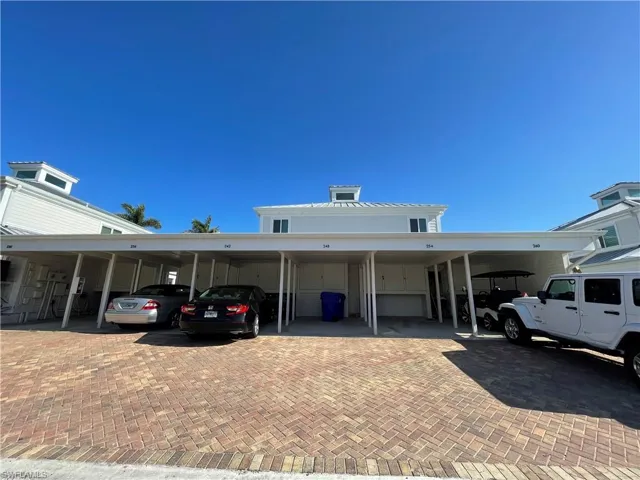 Covered Car Port with Storage Area.