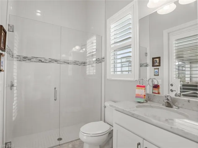 Ceiling to floor Shower tile with seamless glass shower doors