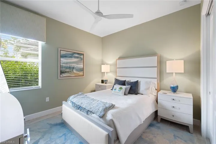 Bedroom featuring ceiling fan and a closet