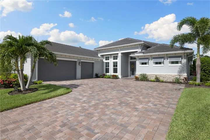 Prairie-style home with a front lawn and a garage
