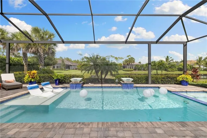 View of pool with glass enclosure