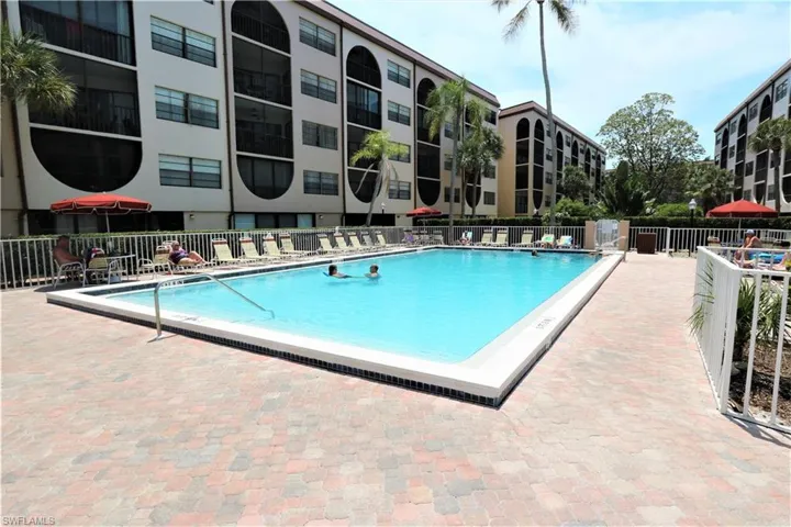 Community pool featuring a patio