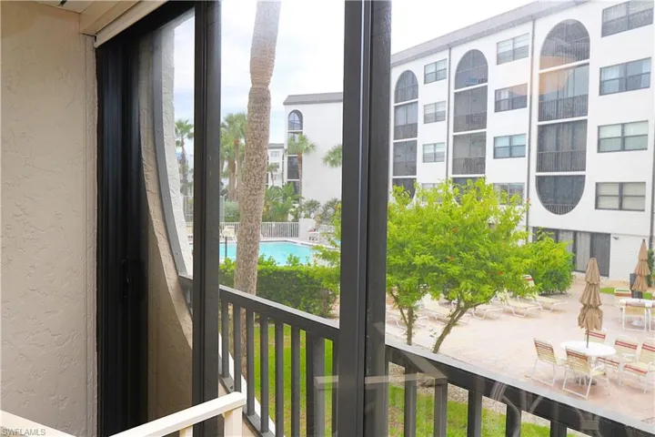 Balcony with view of pool