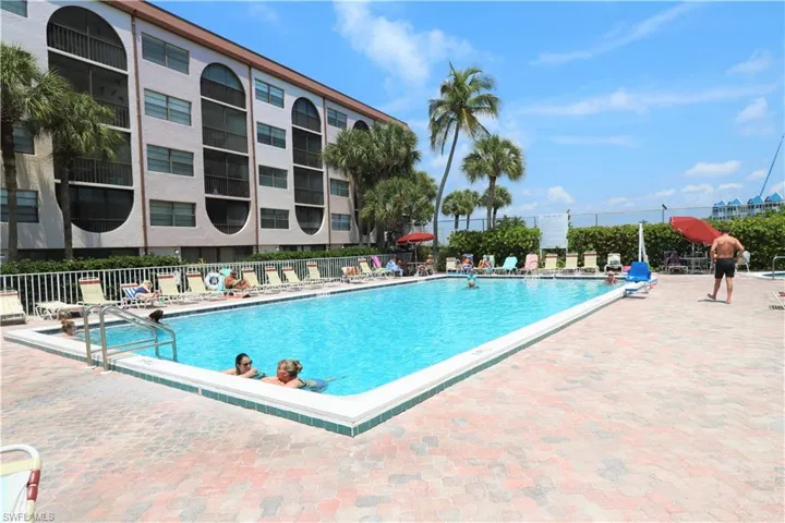 Community pool with a patio area