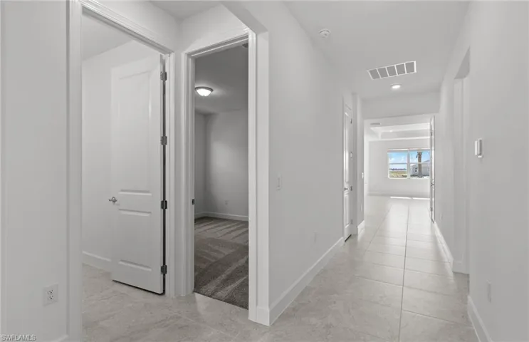 Hall with light tile floors