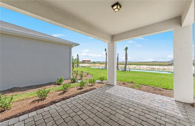 View of patio with a water view