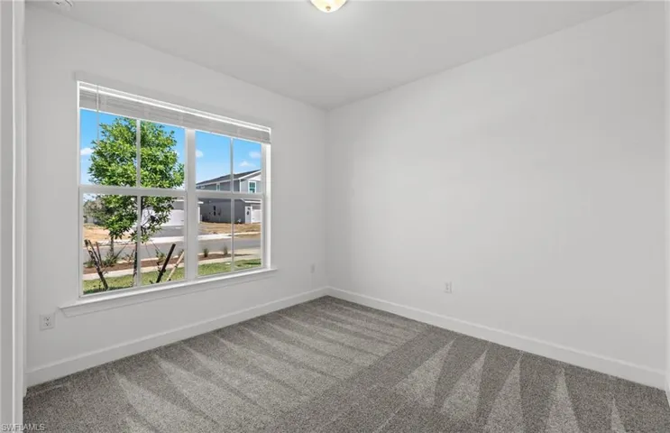 Unfurnished room with carpet floors