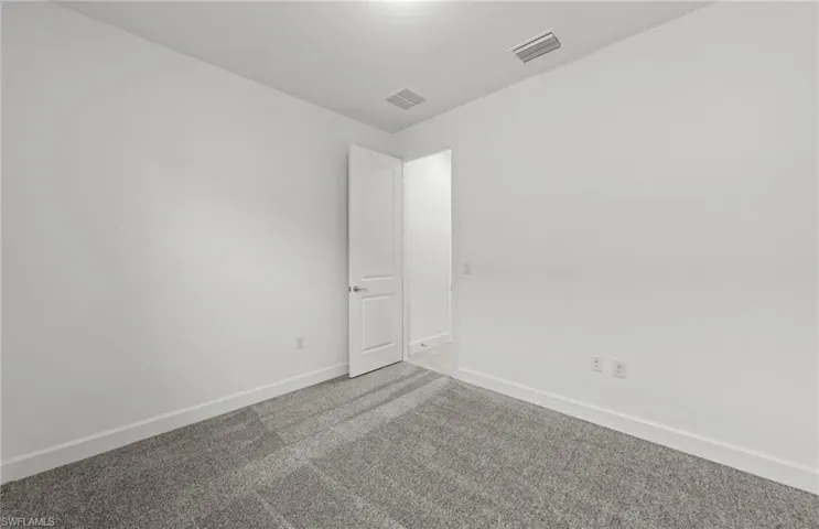 Spare room with carpet flooring