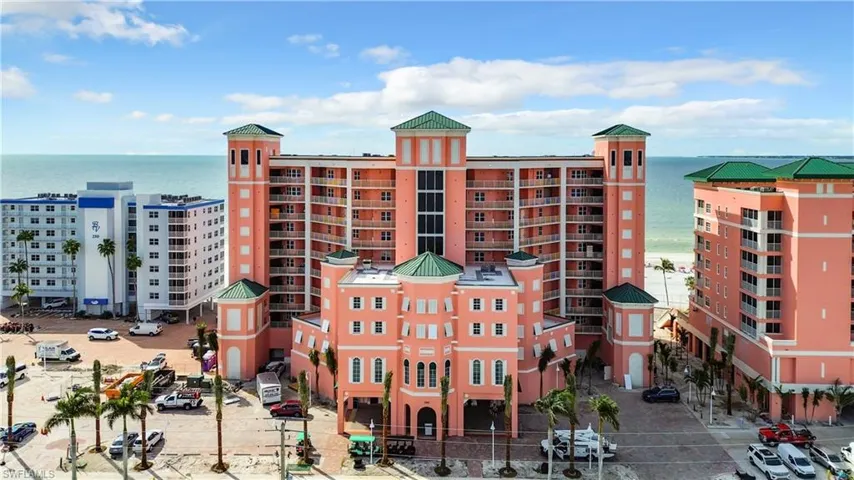 View of building exterior featuring a view of city and a water view
