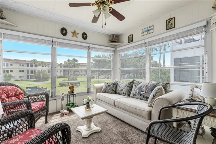 Sunroom / solarium featuring ceiling fan and outdoor lounge area