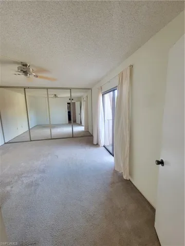 Large Bedroom with Full Length Mirror Closet Doors