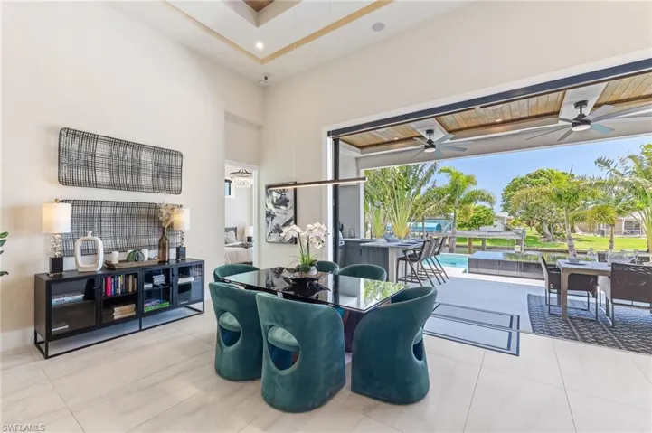 Dining room featuring ceiling fan and tile patterned floors