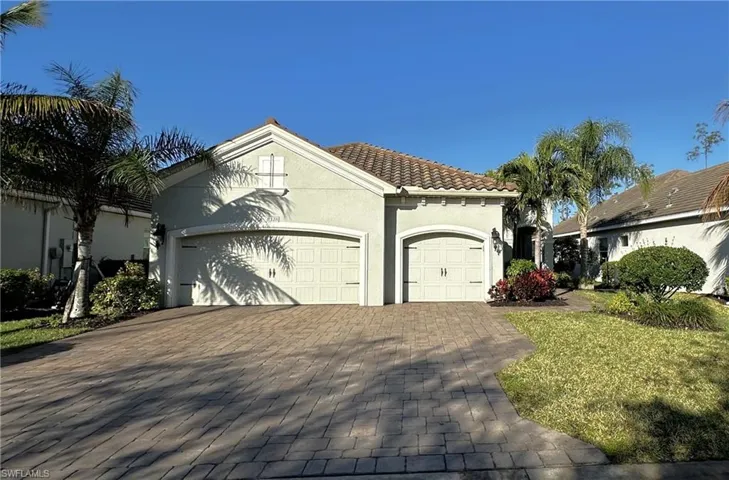 Mediterranean / spanish-style house with a garage