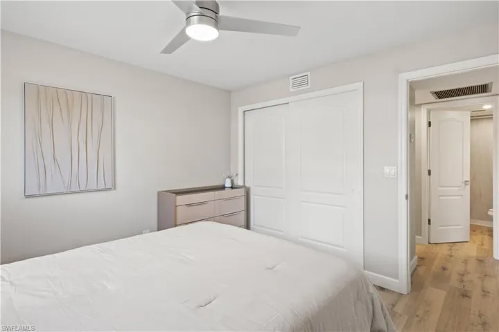 A cozy guest bedroom featuring a queen-sized bed.