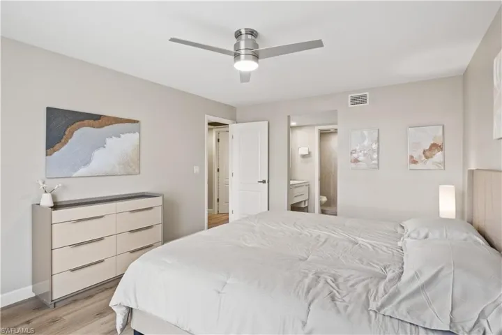 This spacious primary bedroom is a serene retreat.