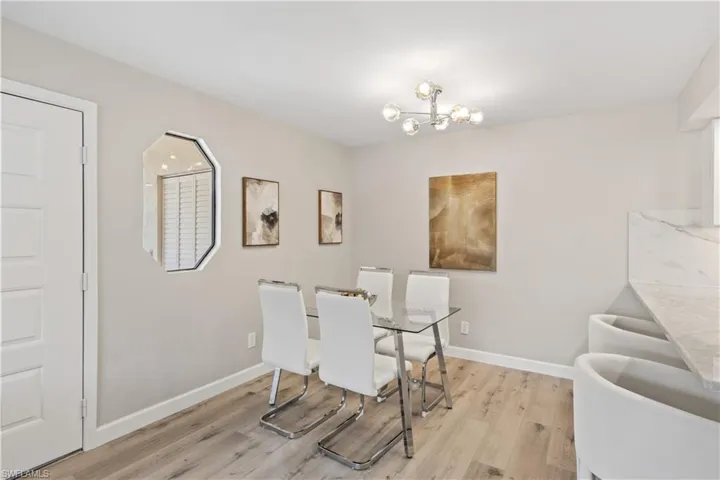 The space is designed to seamlessly flow into the living area, making it ideal for both casual and formal gatherings.