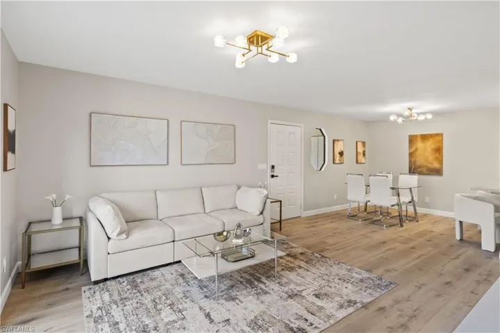 A spacious, bright living room featuring all-new, modern furniture.