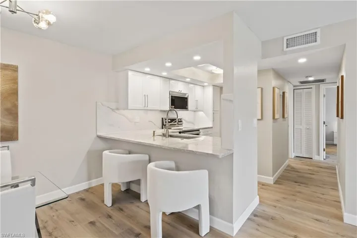The open layout flows seamlessly into the dining area, perfect for entertaining.
