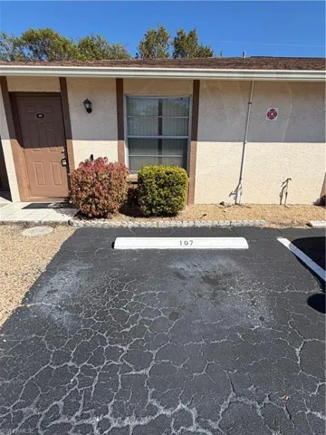 Property entrance featuring personal parking