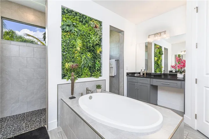 Bathroom with a garden tub and vanity