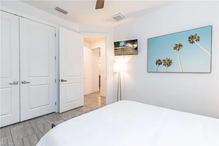 Bedroom featuring ceiling fan and a closet