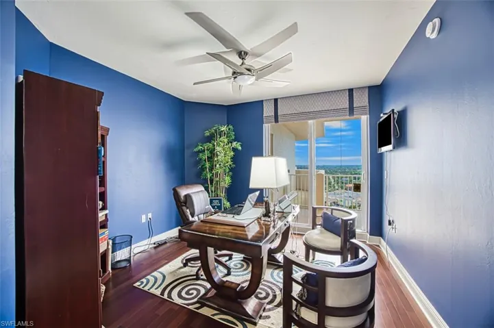 Office area featuring ceiling fan and wood-type flooring