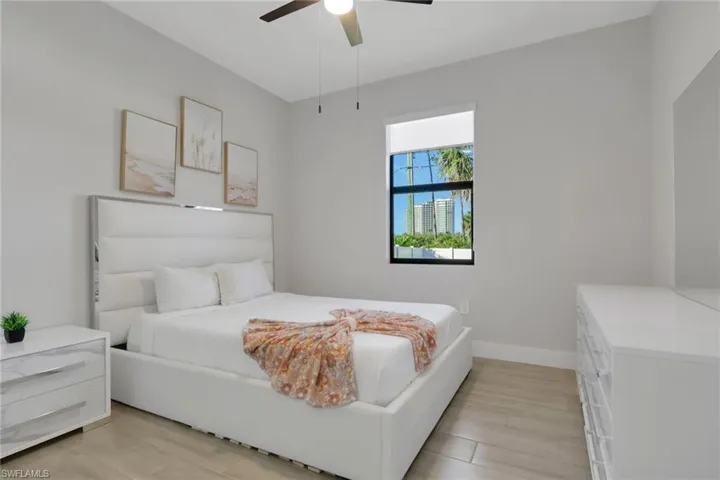 Bedroom featuring wood finish floors and ceiling fan