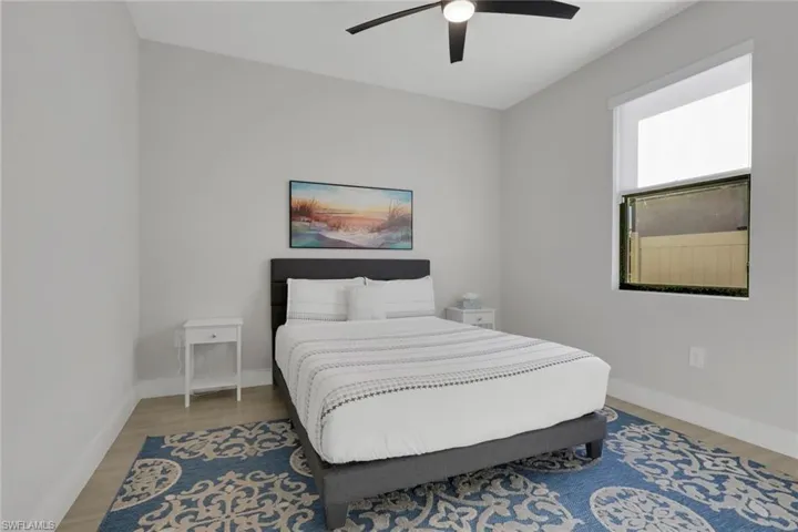 Bedroom featuring ceiling fan and wood finished floors