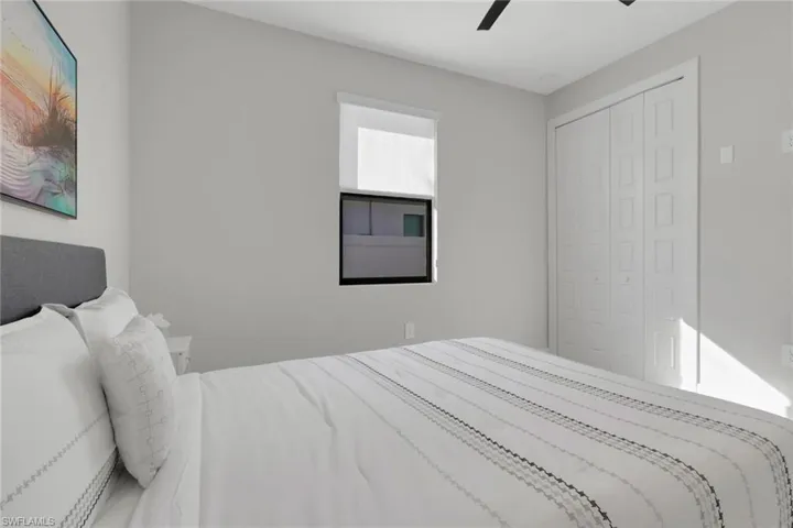 Bedroom featuring ceiling fan and a closet