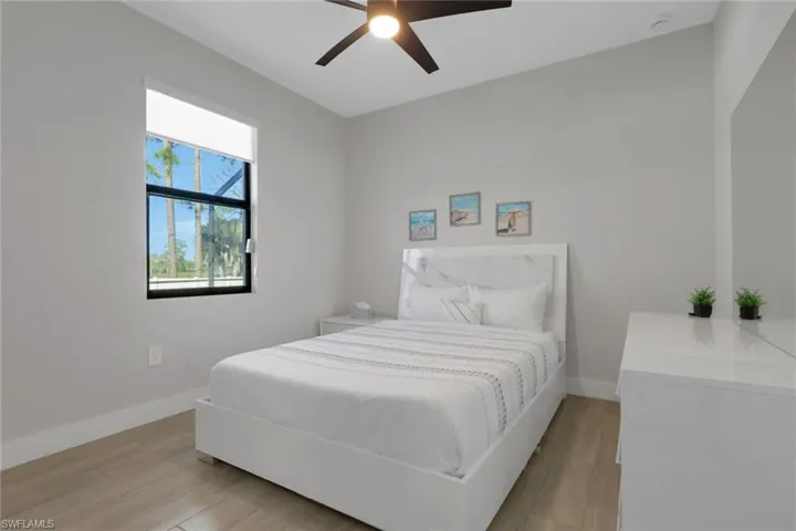 Bedroom featuring light wood finished floors and ceiling fan