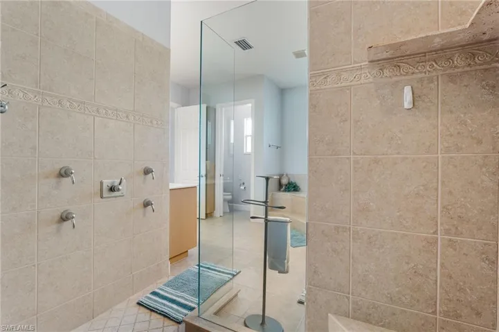 Enormous walk in shower in your primary bathroom.