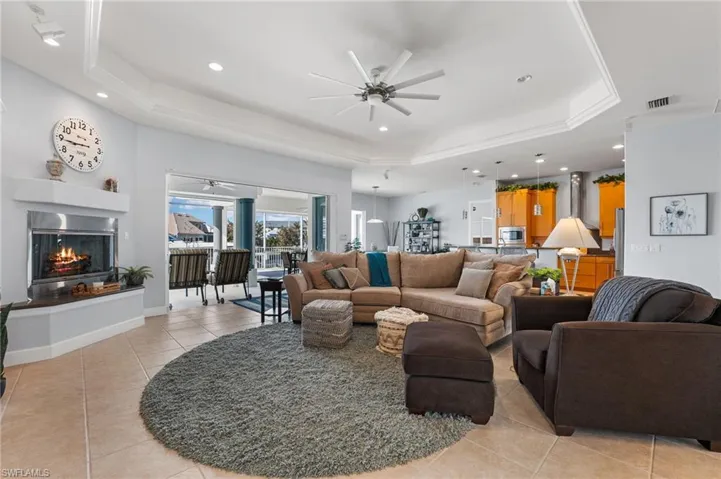 Living room offers 12 ft. tray ceilings and an open concept! Gas burning fireplace! Tile throughout the main living area.