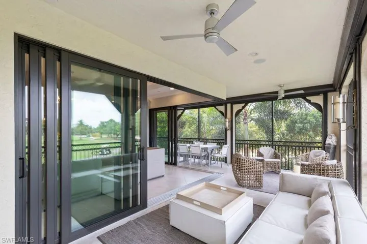 Sunroom with a ceiling fan, a patio area, and outdoor lounge area