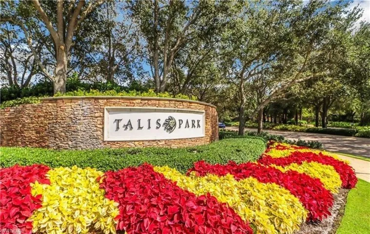 Community sign with view of wooded area