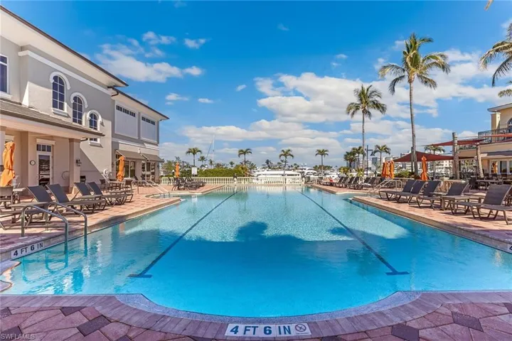 View of community pool with a patio at Gulf Harbour