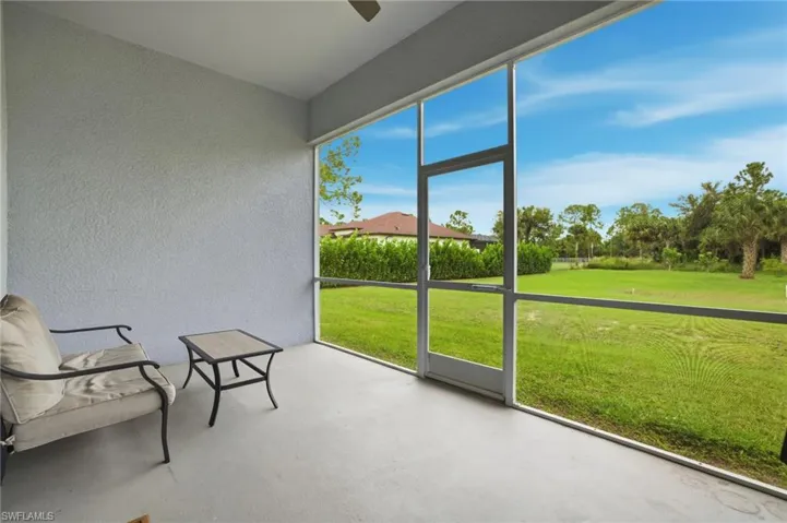 Unfurnished sunroom featuring ceiling fan
