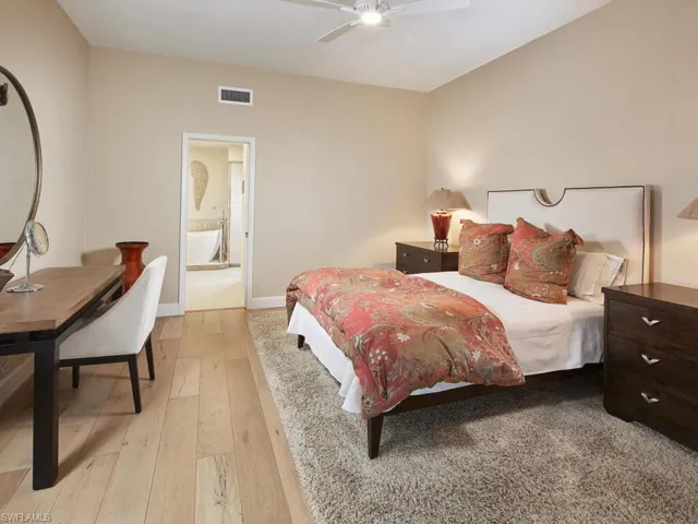 Spacious primary retreat with warm tones and peaceful views.