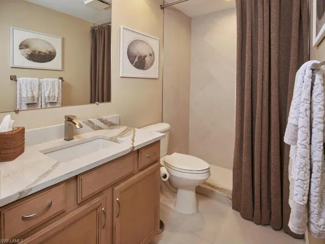 Guest bathroom with walk in shower.