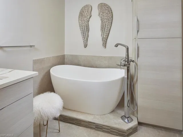 Beautifully designed bathroom with modern finishes and a standalone tub.