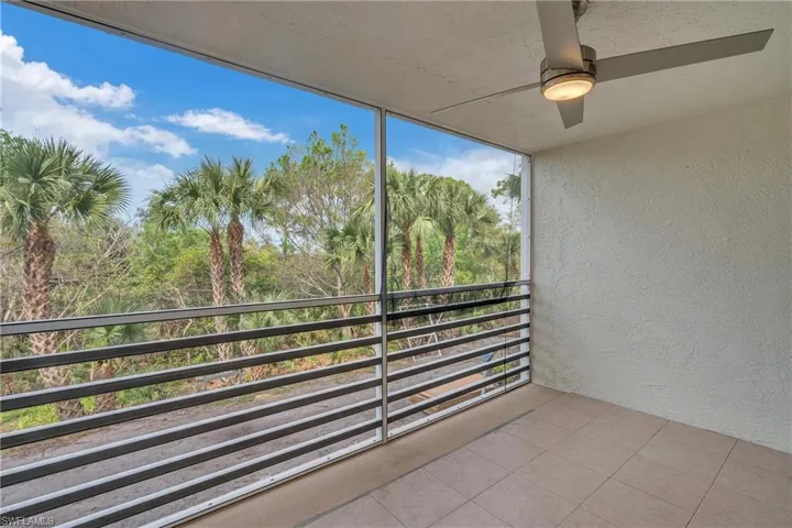 Balcony with ceiling fan and a sunroom